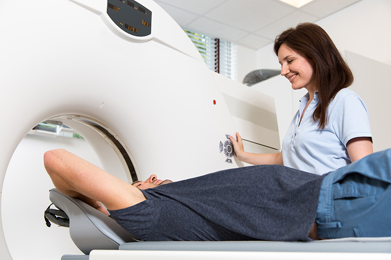 Green Imaging CT Scan with patient and technician