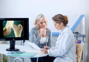 Women and Doctor reviewing done health